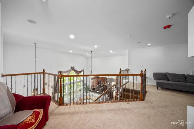 a living room with furniture ceiling fan and a rug