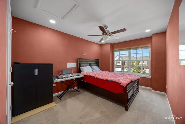 a bed room with a bed and a large window