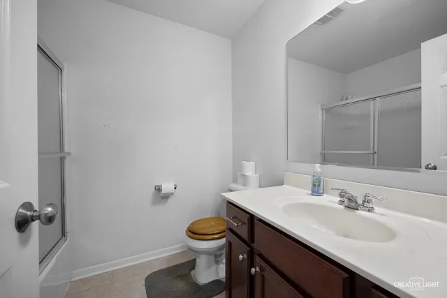 a bathroom with a sink toilet and vanity