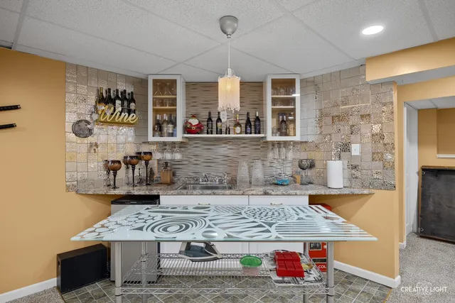 a dining table with chairs and window