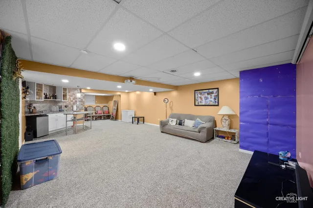 a lobby with furniture and a rug