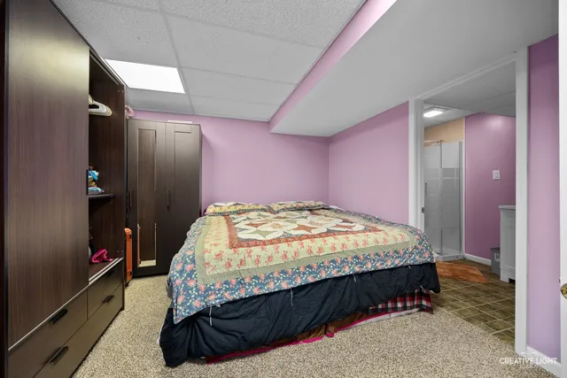 a bedroom with a bed and a walk in closet
