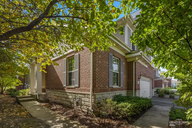 a tree in front of a house