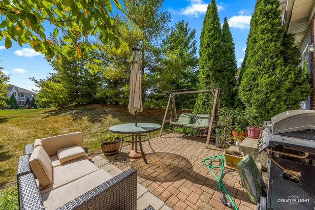 a view of backyard with furniture and garden