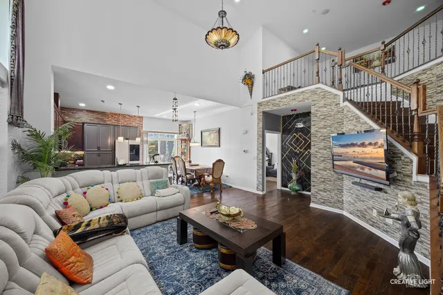 a living room with furniture and a mirror
