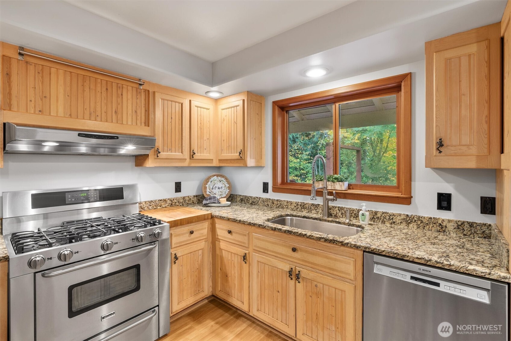 14012 Ingraham Road Monroe, WA 98272 - Photo 11 of 40 a kitchen with a sink stove top oven and cabinets