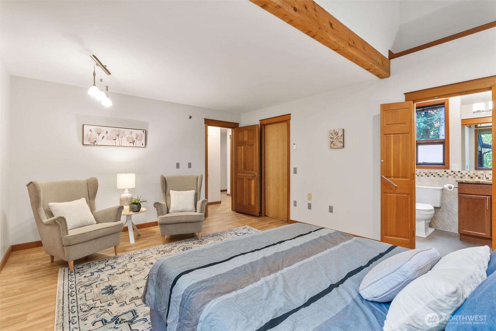 14012 Ingraham Road Monroe, WA 98272 - Photo 16 of 40 a bedroom with a bed and wooden floor