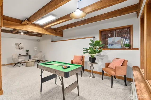 a dining room with furniture and wooden floor