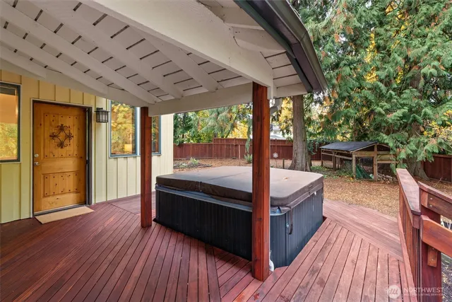 a view of a balcony with furniture and wooden floor