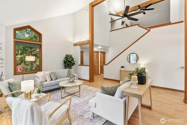 a living room with furniture and wooden floor