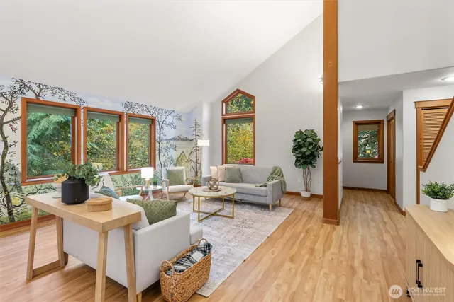 a living room with furniture and a large window