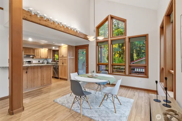 a view of a dining room with furniture window and wooden floor