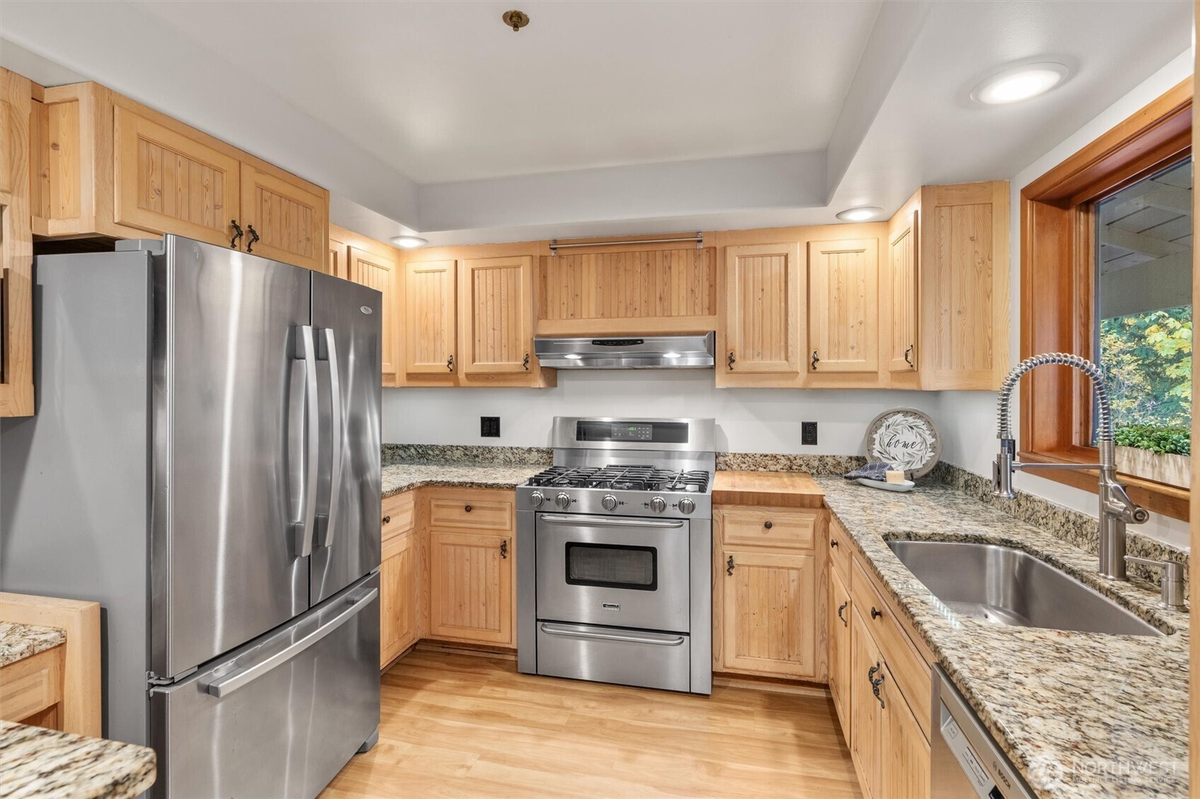 14012 Ingraham Road Monroe, WA 98272 - Photo 10 of 40 a kitchen with stainless steel appliances granite countertop a refrigerator stove and sink