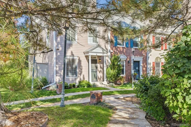 a front view of a building with garden