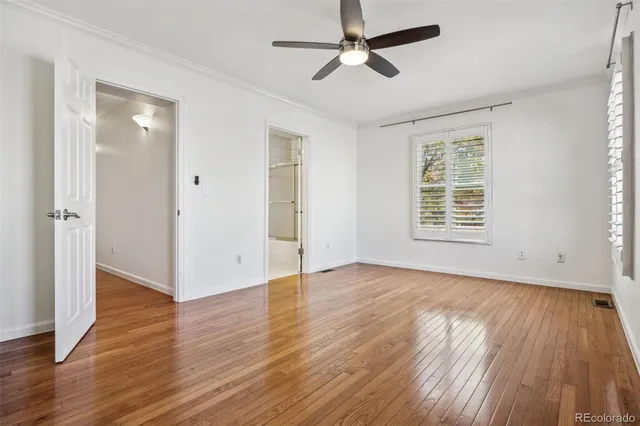 a spacious bathroom with a granite countertop sink mirror and a