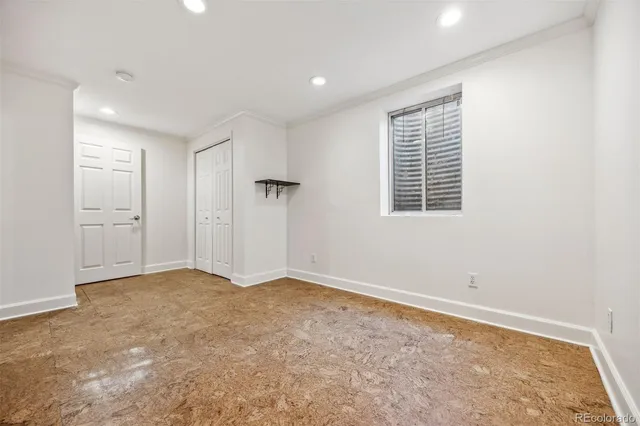 a view of a house with a table and chairs in patio