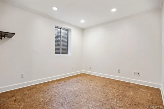 a view of a room with wooden floor and windows