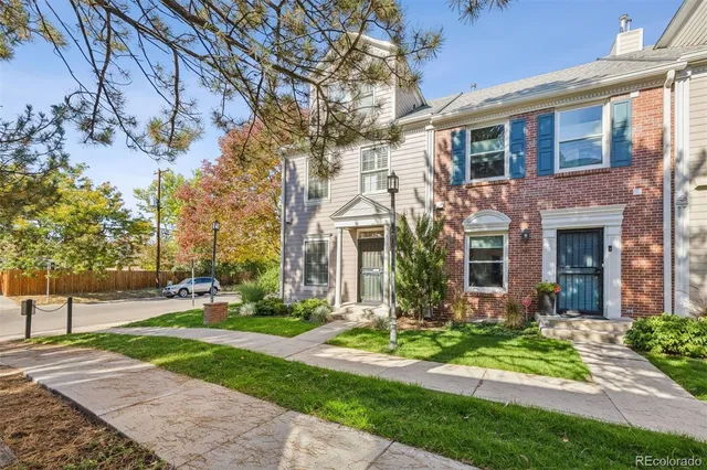 a view of a patio with a table and chairs