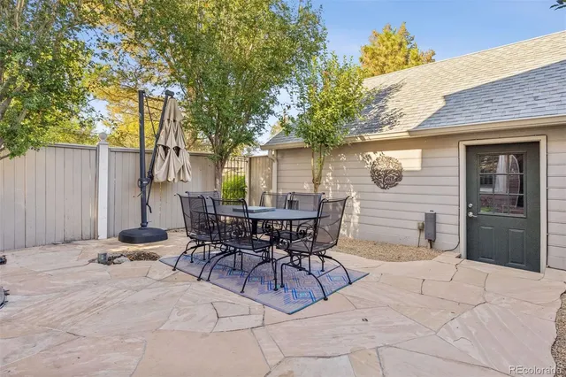 a view of empty room with wooden floor and fireplace