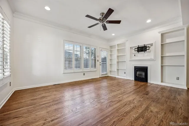 a view of a kitchen with wooden floor and a chandelier