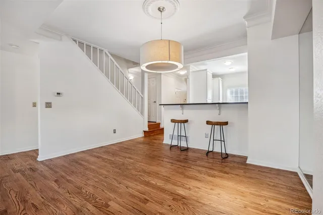 a kitchen with stainless steel appliances granite countertop white cabinets a sink and dishwasher