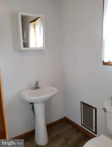 a bathroom with a sink toilet