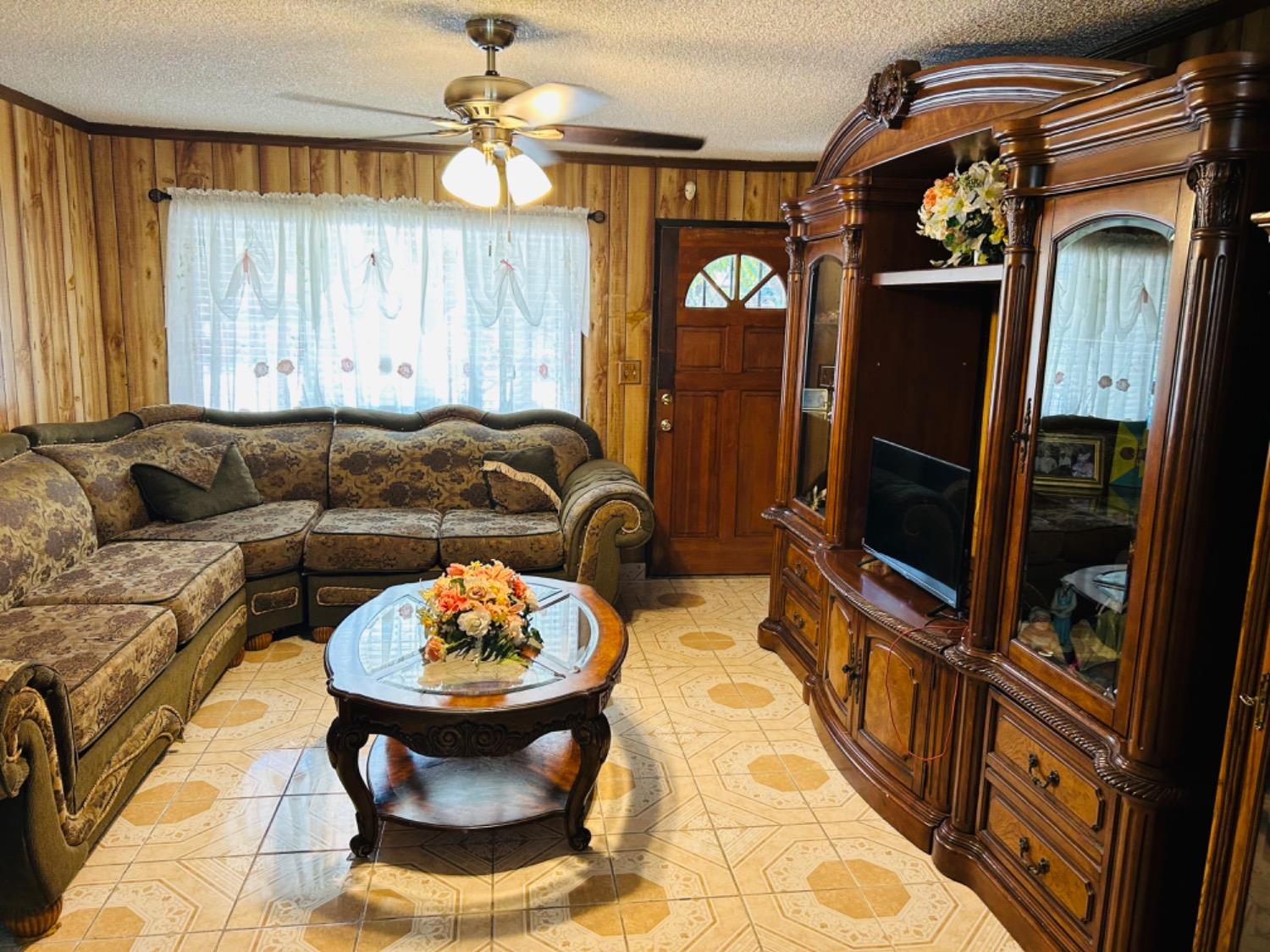 355 J Street Mendota, CA 93640 - Photo 12 of 21 a living room with furniture and a window