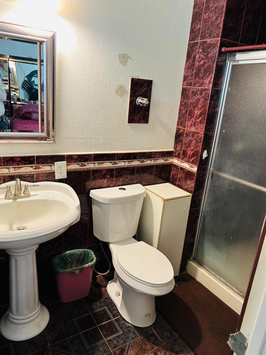 355 J Street Mendota, CA 93640 - Photo 14 of 21 a bathroom with a toilet sink and mirror