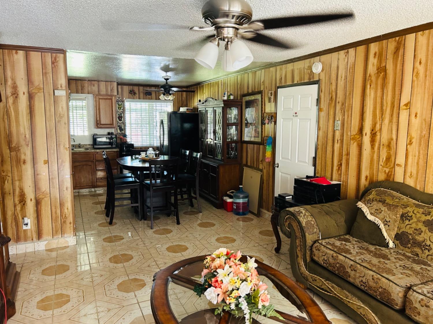 355 J Street Mendota, CA 93640 - Photo 6 of 21 a living room with furniture and a chandelier