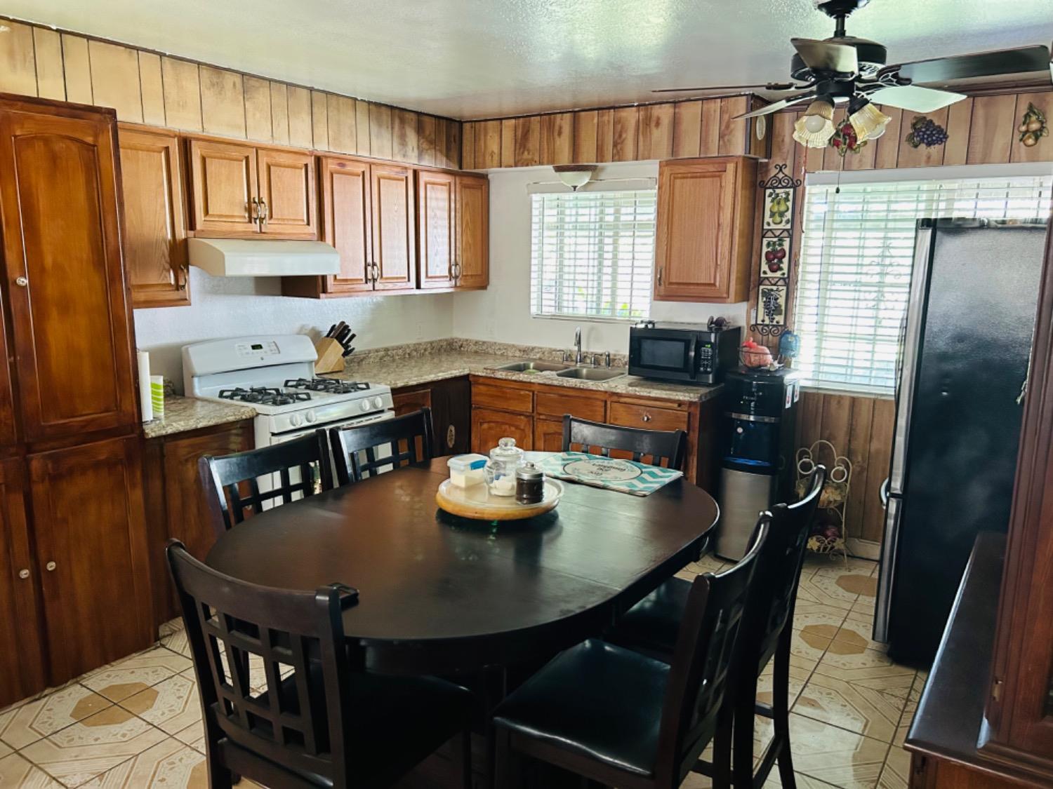 355 J Street Mendota, CA 93640 - Photo 8 of 21 a kitchen with a dining table and chairs