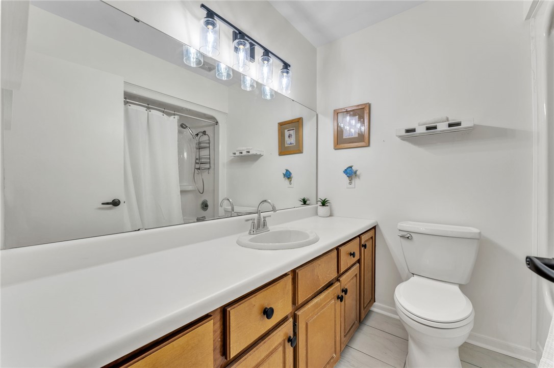 4416 Denver Cove Road Anderson, SC 29625 - Photo 17 of 31 A well-appointed bathroom offers a generous vanity with ample storage, a shower, and pristine flooring.