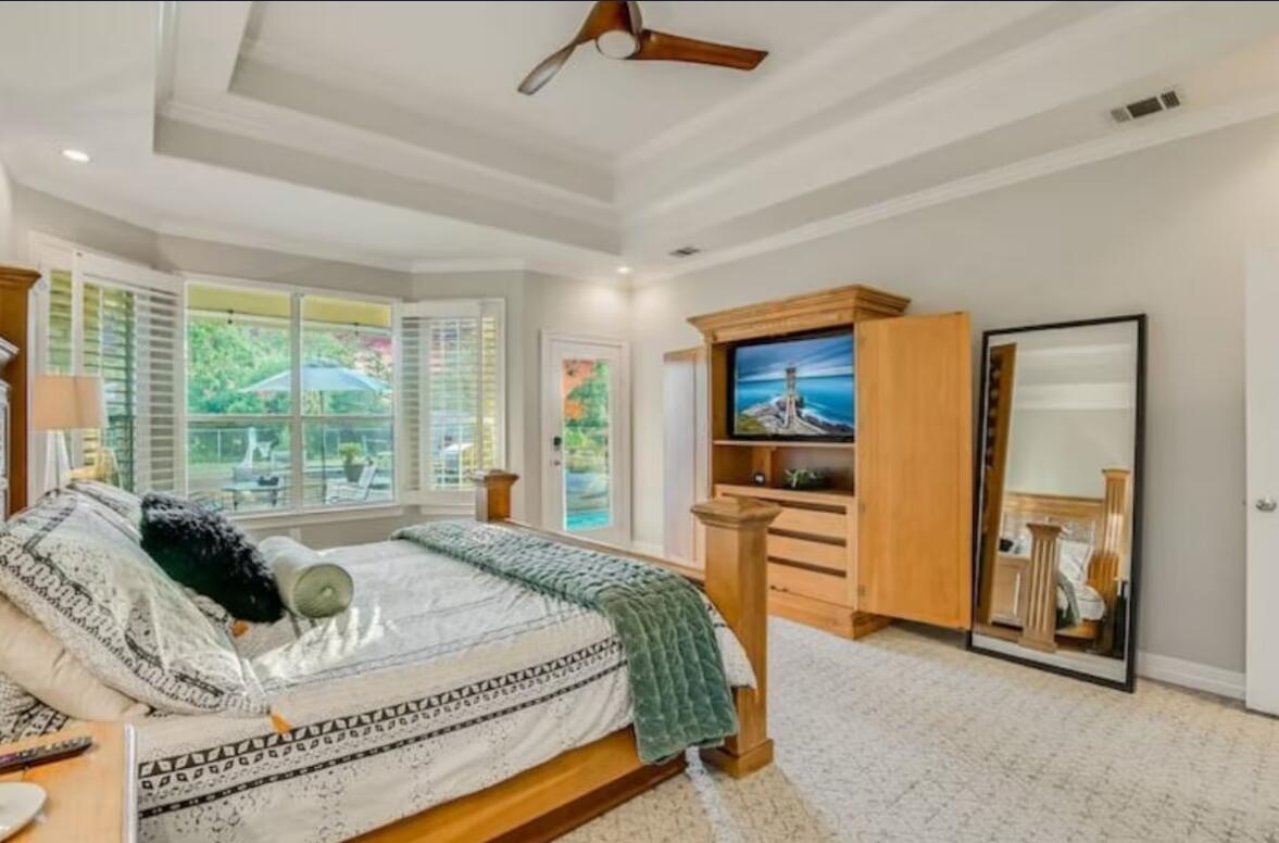 413 Breakaway Road Cedar Park, TX 78613 - Photo 13 of 21 Carpeted bedroom featuring a ceiling fan, ornamental molding, and access to exterior