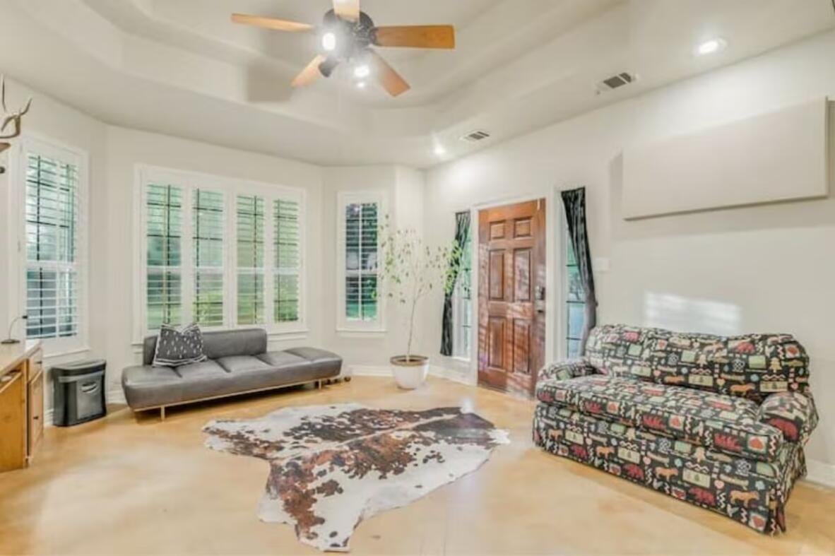 413 Breakaway Road Cedar Park, TX 78613 - Photo 15 of 21 Sitting room with a ceiling fan, a tray ceiling, recessed lighting, and healthy amount of natural light