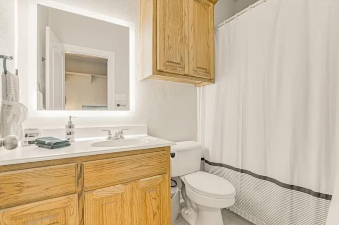 413 Breakaway Road Cedar Park, TX 78613 - Photo 18 of 21 Full bath with a shower with curtain and vanity