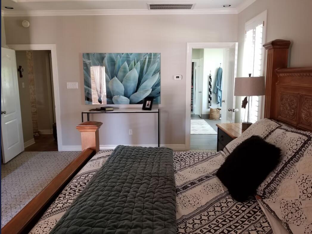 413 Breakaway Road Cedar Park, TX 78613 - Photo 2 of 21 Bedroom with crown molding and baseboards