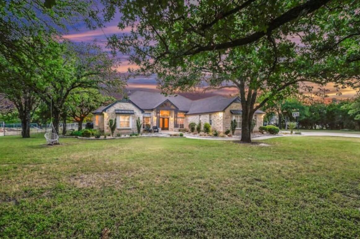 413 Breakaway Road Cedar Park, TX 78613 - Photo 21 of 21 View of front facade featuring a front lawn