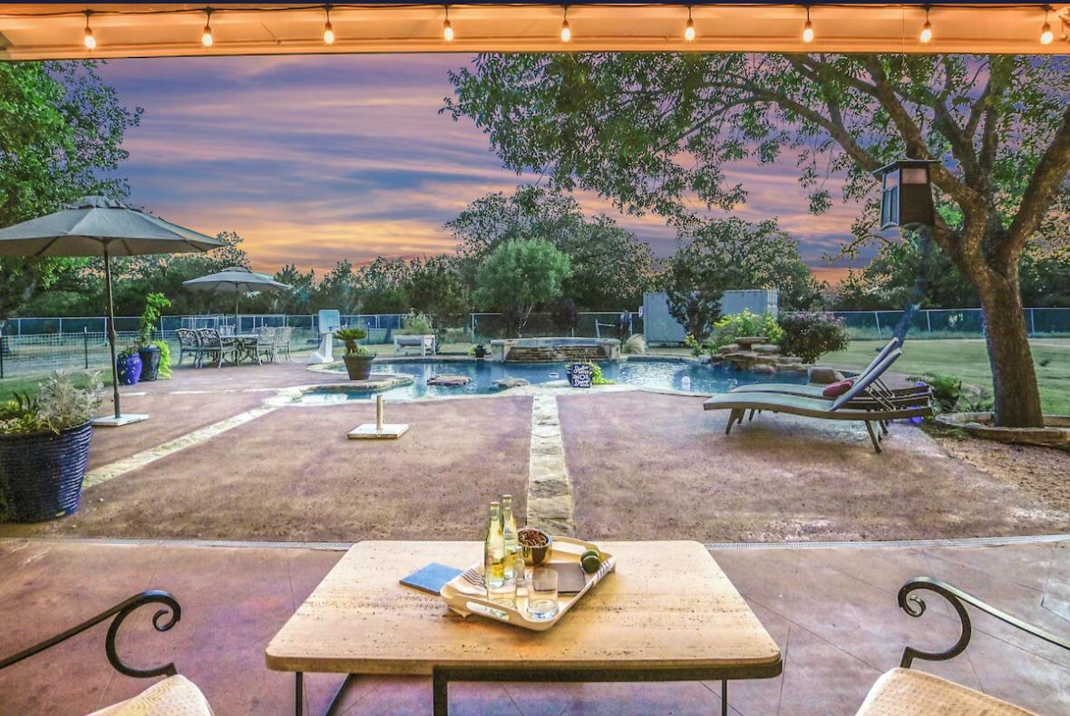 413 Breakaway Road Cedar Park, TX 78613 - Photo 3 of 21 Fenced backyard with outdoor dining area, a patio area, and an in-ground hot tub