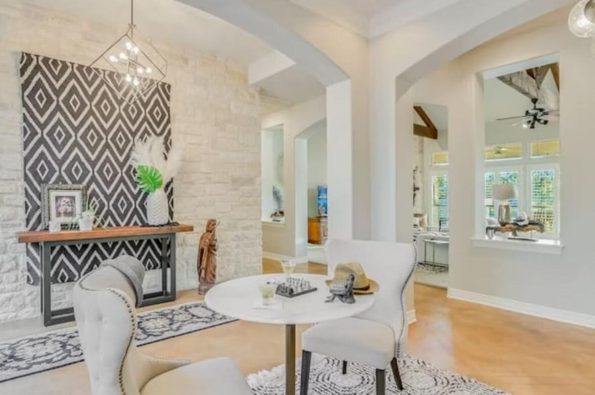 413 Breakaway Road Cedar Park, TX 78613 - Photo 8 of 21 Dining space with suspended lighting, arched walkways, and a ceiling fan