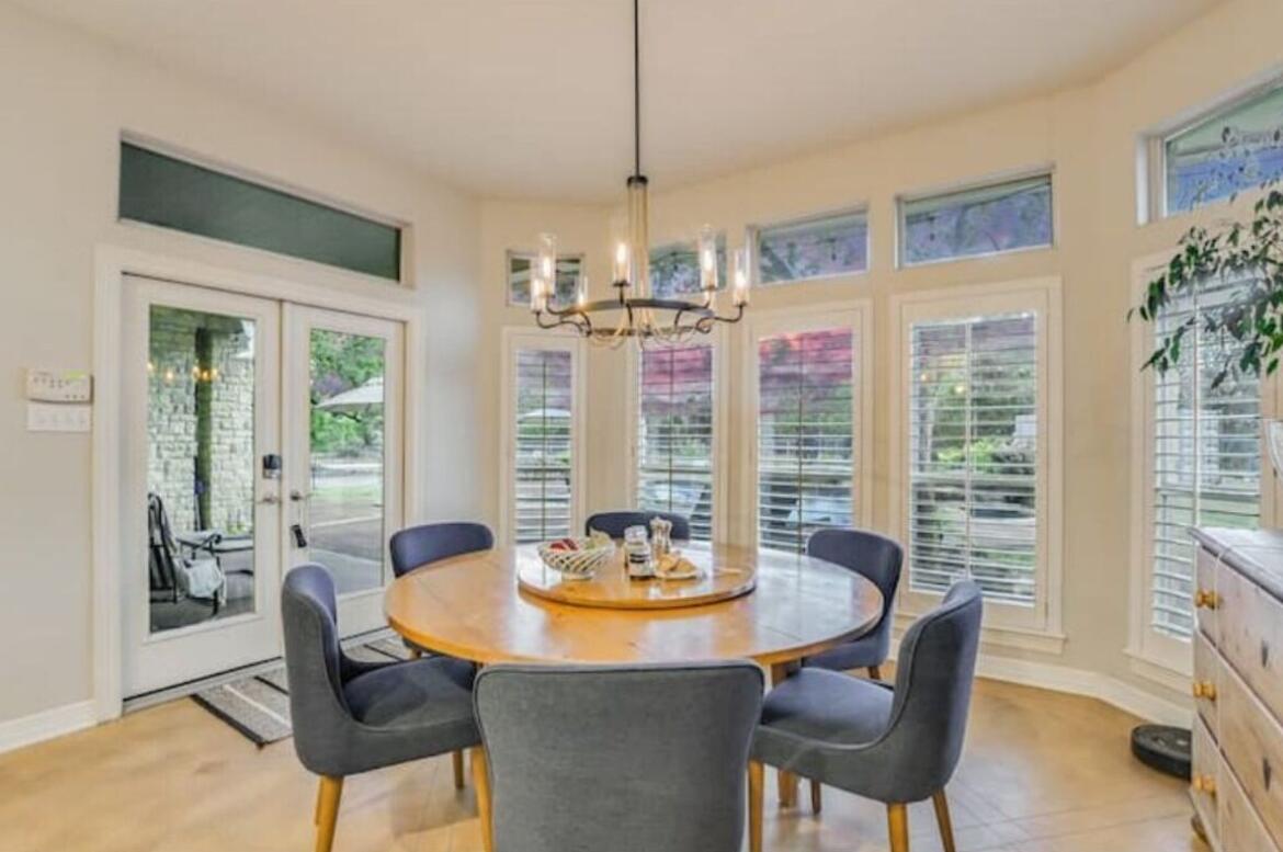413 Breakaway Road Cedar Park, TX 78613 - Photo 9 of 21 Dining area with french doors and a chandelier