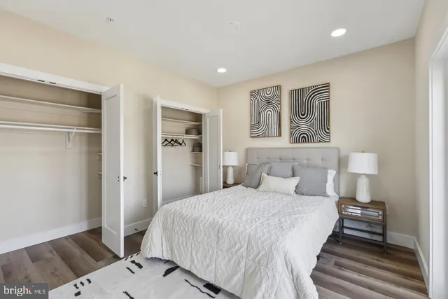 a spacious bedroom with a bed and a table