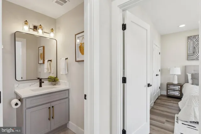 a bathroom with a double vanity sink mirror and