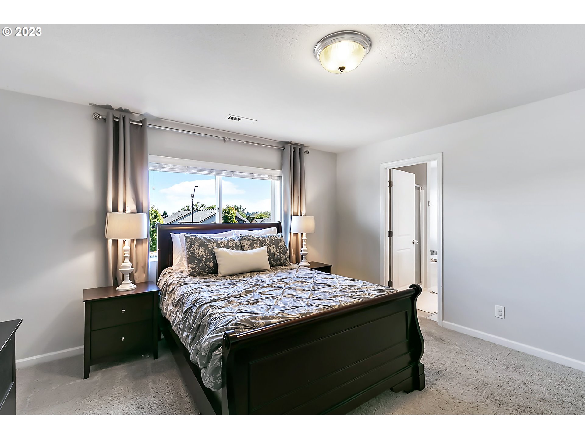 298 North 34th Court Ridgefield, WA 98642 - Photo 18 of 36 a bedroom with a bed and a dresser