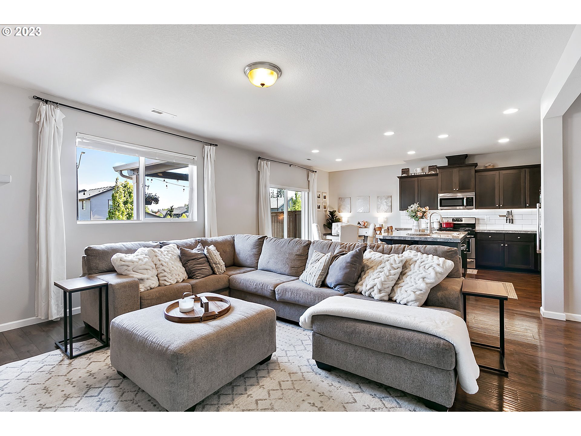 298 North 34th Court Ridgefield, WA 98642 - Photo 8 of 36 a living room with furniture and a view of kitchen