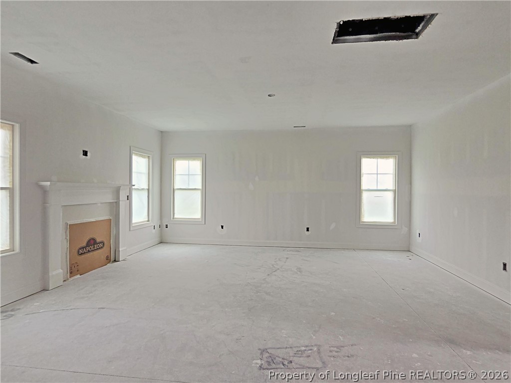 2650 Norrington Road Lillington, NC 27546 - Photo 6 of 24 a view of empty room with a fireplace