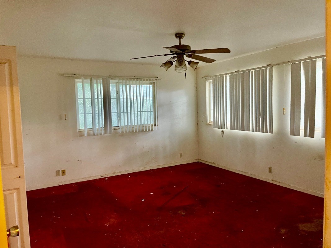 6296 Olohena Road Kapaa, HI 96746 - Photo 13 of 30 a view of a livingroom with a ceiling fan and window