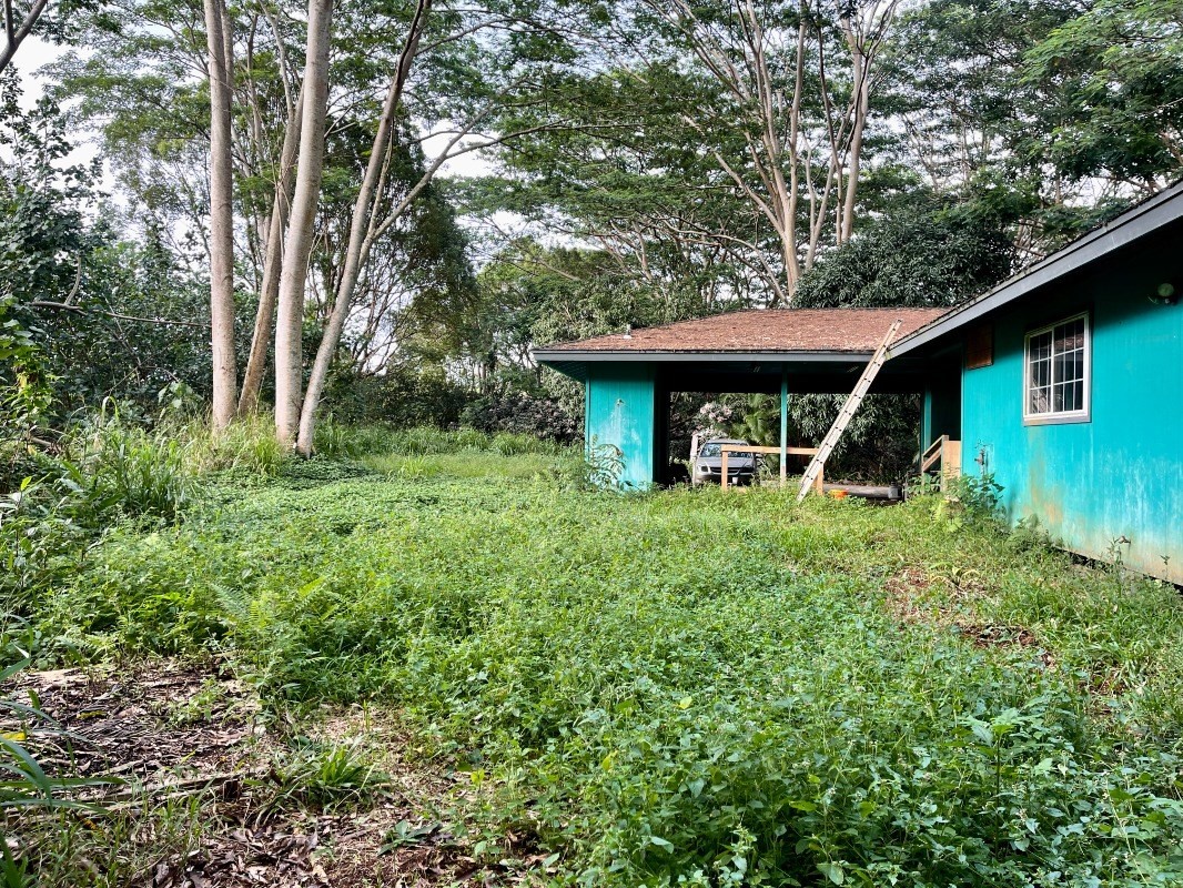6296 Olohena Road Kapaa, HI 96746 - Photo 4 of 30 a front view of a house with garden
