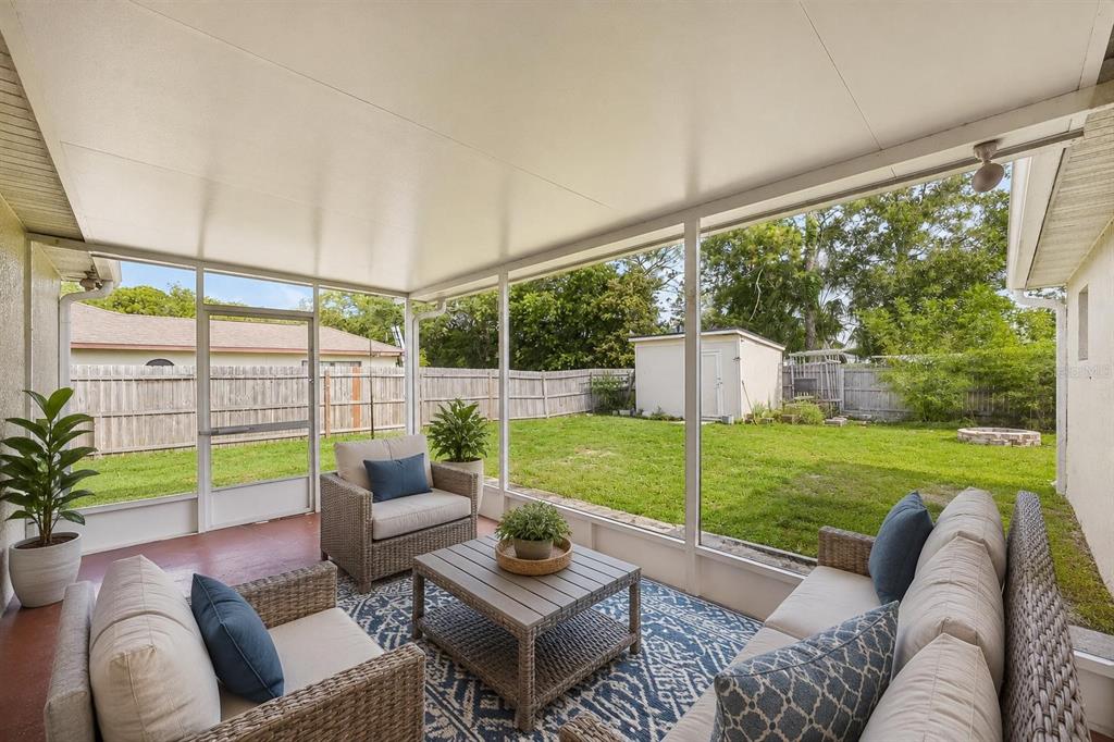10303 Fordham Street Spring Hill, FL 34608 - Photo 19 of 25 a living room with furniture and a garden