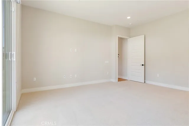 a bathroom with a double vanity sink a mirror and a bathtub