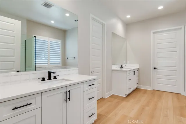 a bathroom with a bathtub and shower