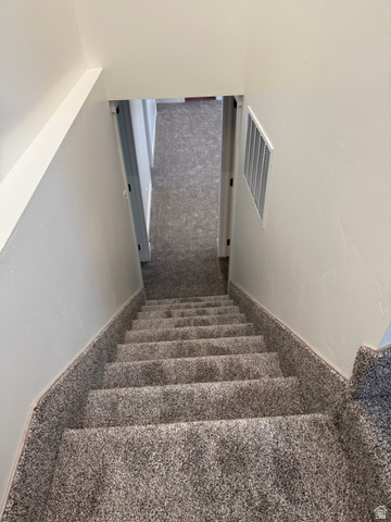 2865 North 3250 W Road Sutherland, UT 84624 - Photo 23 of 28 Carpeted staircase with light white walls